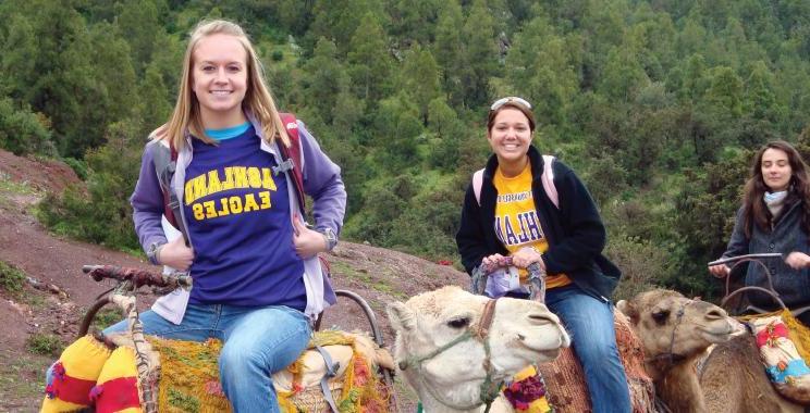 Ashland University study abroad students sitting on camels